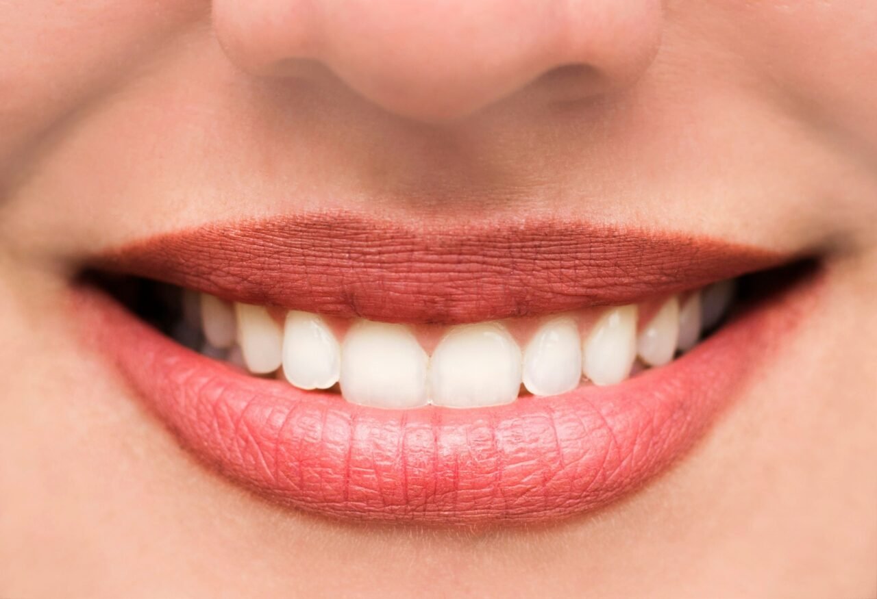 woman-s-lips-and-teeth-smile-close-up.jpg